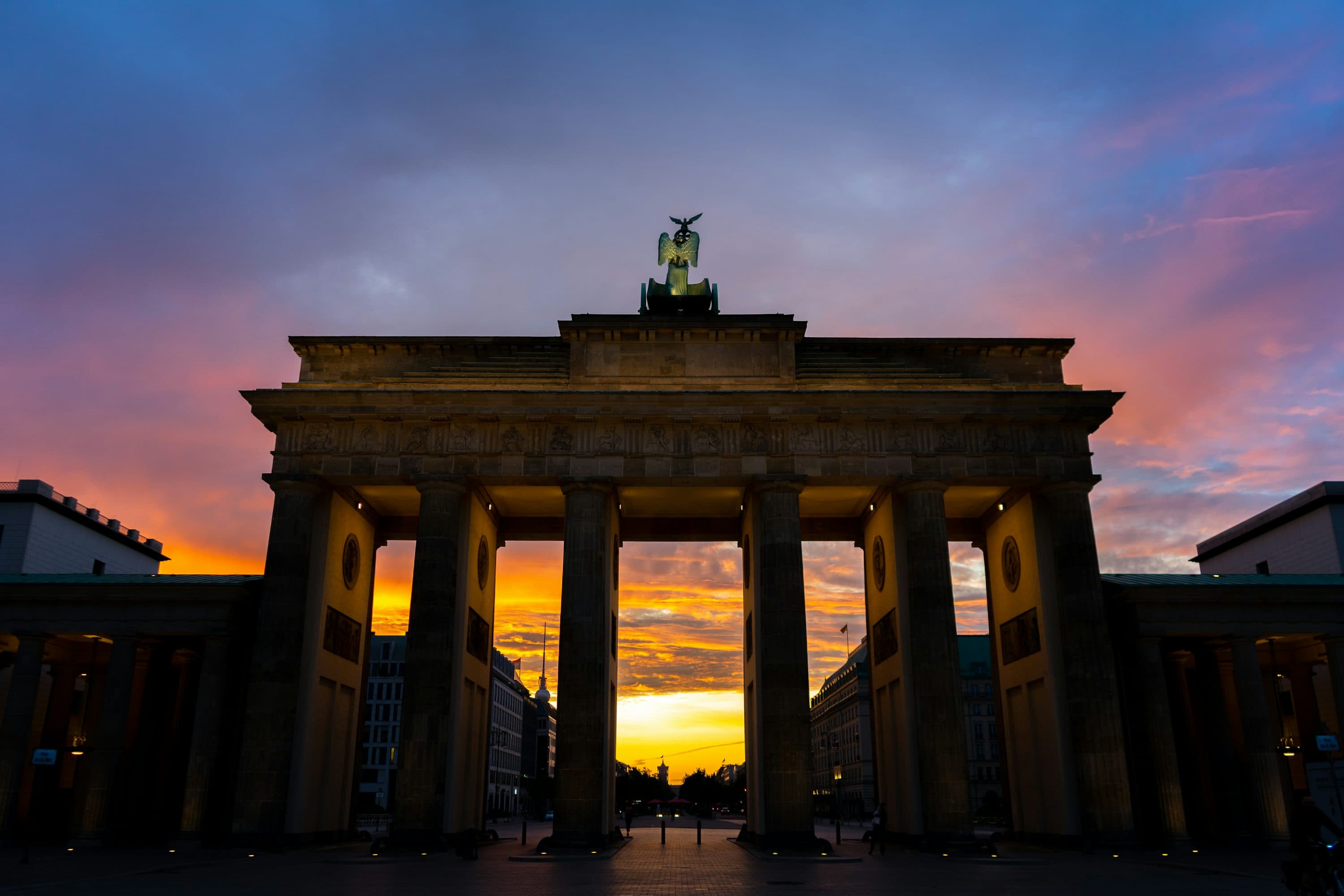 The Brandenburg Gate at dusk, lit by the evening sky
